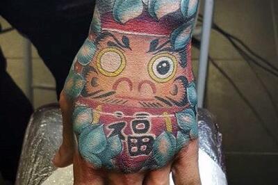 不倒翁纹身图案及寓意 源自达摩的日本吉祥物